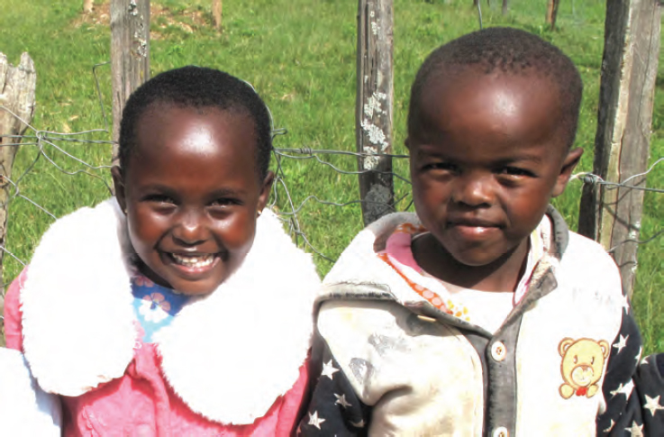 Photo of two African children smiling.