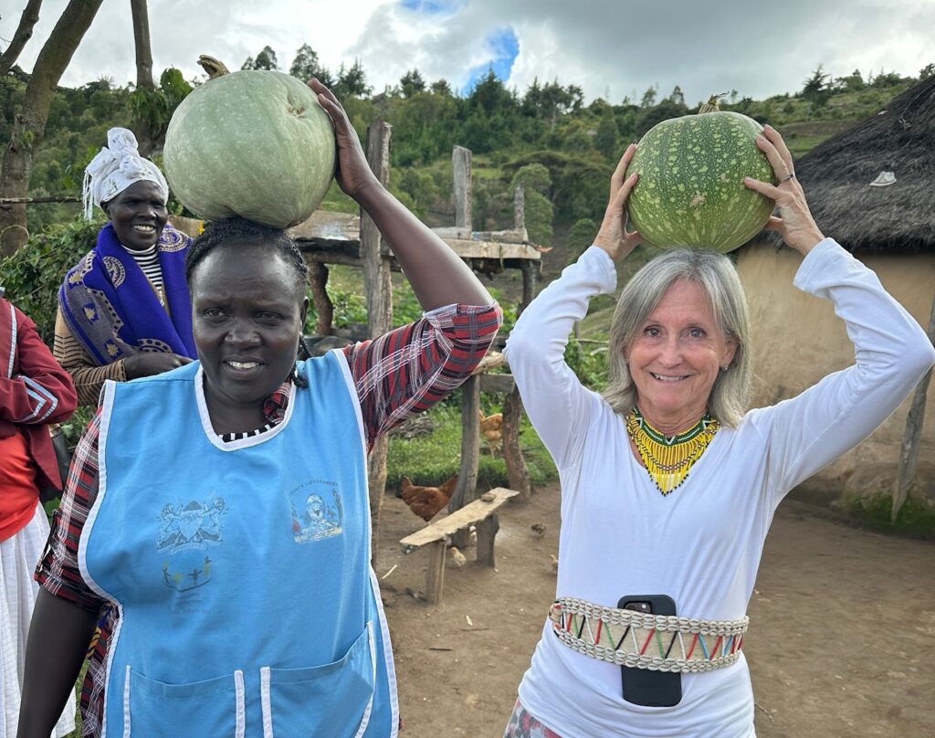 two women holding gourds on their heads